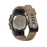 Back view of  G-shock GA100L-8A watch with a tan strap on a white background