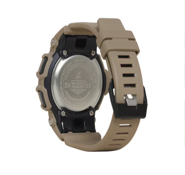 Back view of  G-shock GA100L-8A watch with a tan strap on a white background
