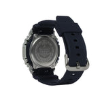 Back view of a Casio watch with a black strap on a white background