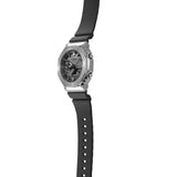 Watch with black strap and silver case on a white background