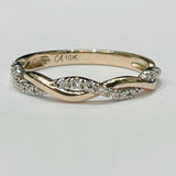 This stunning twist ring is perfect to add to your stackable...