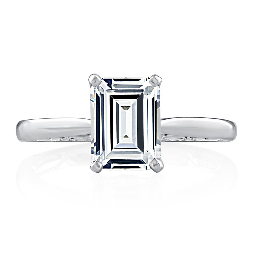 Emerald diamond solitaire with petal detail in under gallery