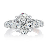 Classic Four Prong Oval Cut Diamond Flanked Engagement Ring