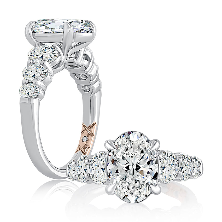 Classic Four Prong Oval Cut Diamond Flanked Engagement Ring