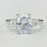 Romance - Three Stone Modern Style Pear And Oval Diamond Setting