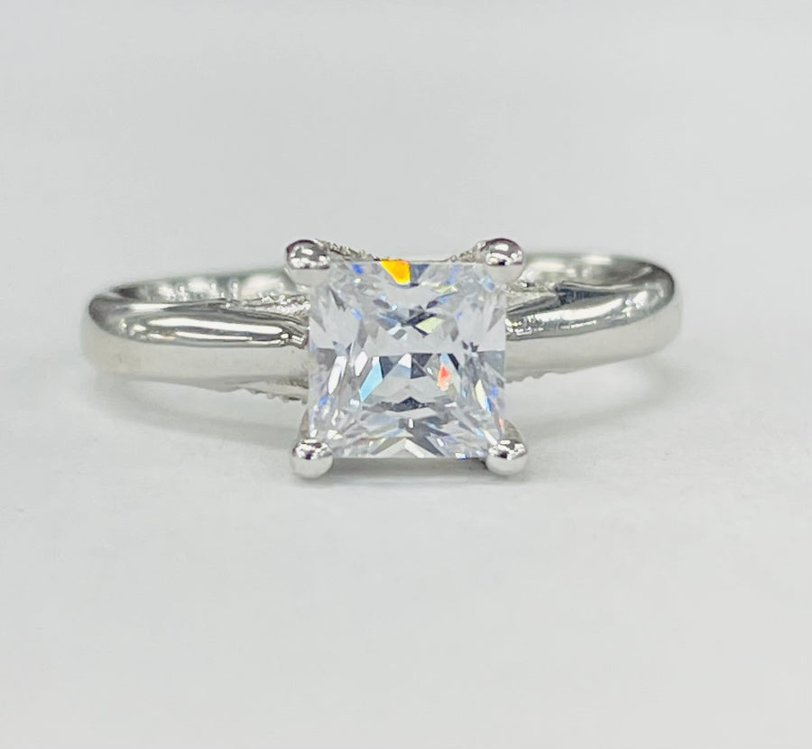 Romance - White Gold Solitare W/ Diamond Accented Head Setting