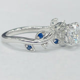 ArtCarved - Floral Inspired Diamond And Sapphire Setting