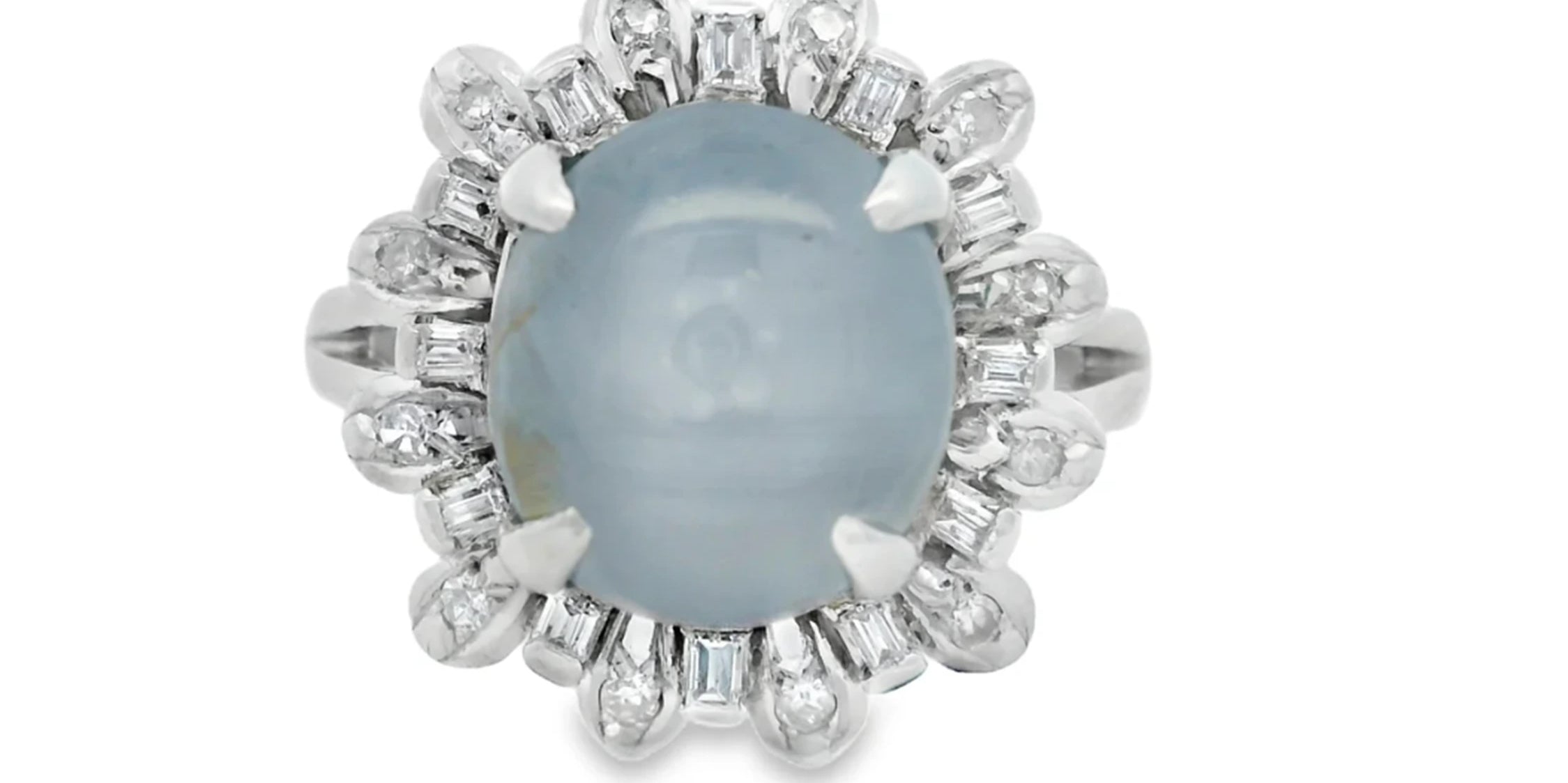 Silver ring with a blue gemstone and diamond accents on a white background