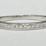 This delicate stackable womens ring features a 14k white gol...