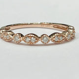 This fun and fashionable ring is a 10k rose gold diamond rin...