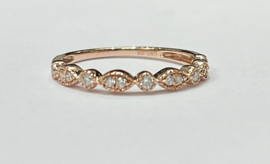 This fun and fashionable ring is a 10k rose gold diamond rin...