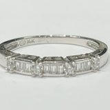 This delicate stackable ring features a 14k white gold band ...