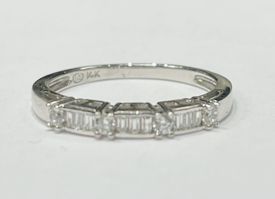 This delicate stackable ring features a 14k white gold band ...