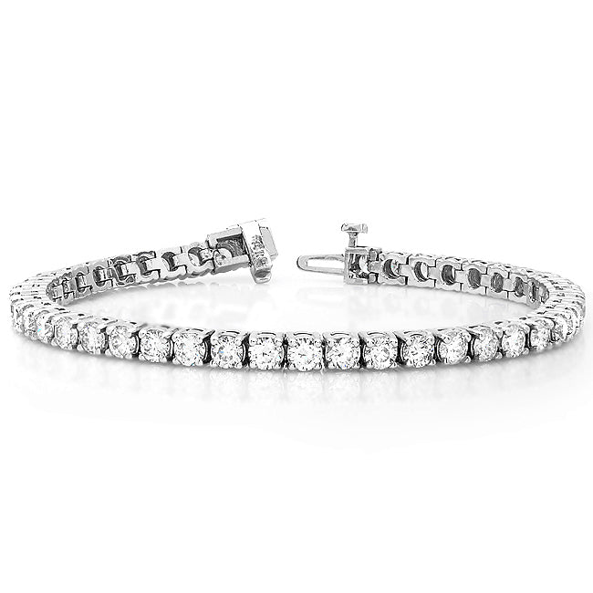 A white gold tennis bracelet with multiple diamonds set in a classic six-prong setting.