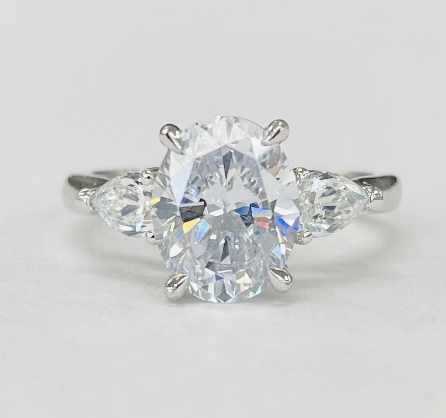 Romance - Three Stone Modern Style Pear And Oval Diamond Setting