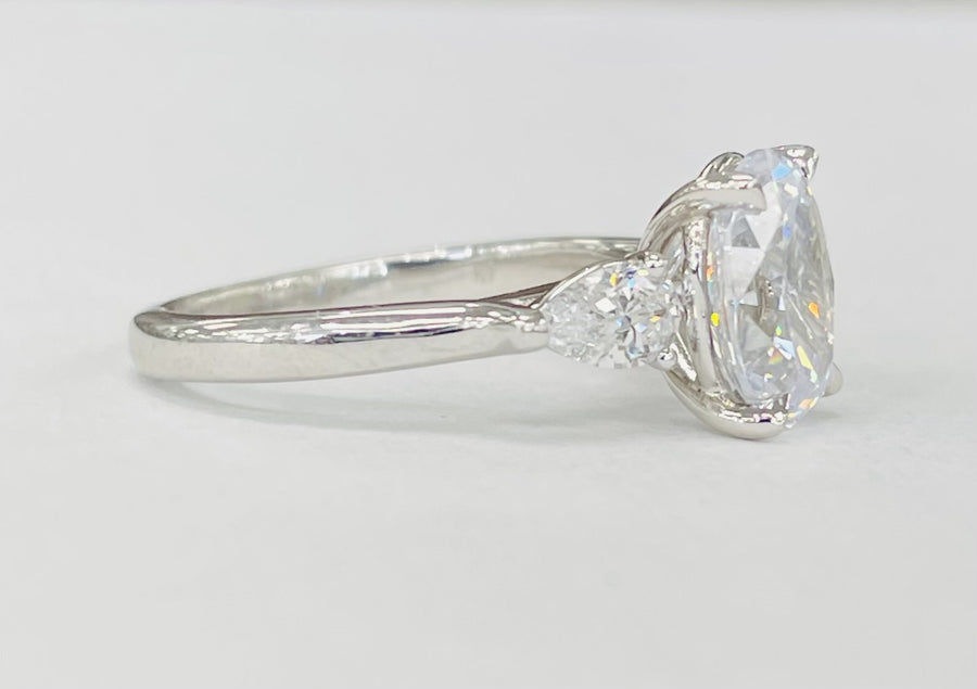 Romance - Three Stone Modern Style Pear And Oval Diamond Setting