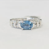 Modern East/West Style Blue Topaz Ring